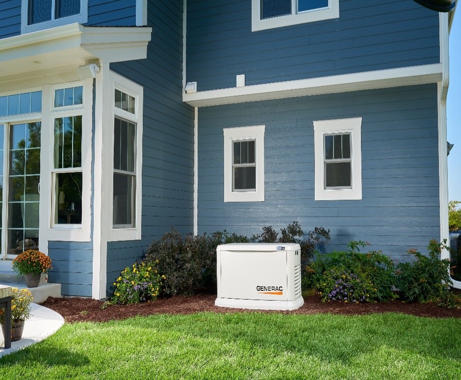A standby generator installed beside a home